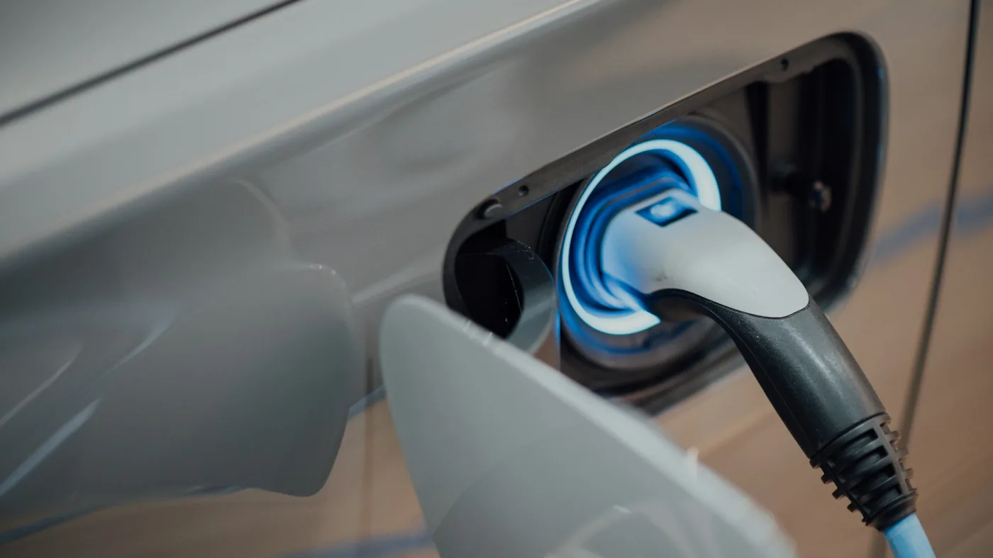 Electric vehicle being charged